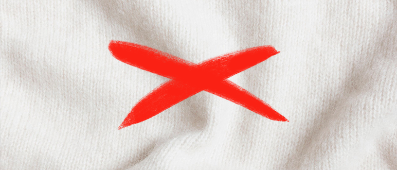 Laine interdit Matière laine avec une croix rouge dessus pour illuster qu'il ne faut pas porter de matière qui peuvent démanger le tatouage